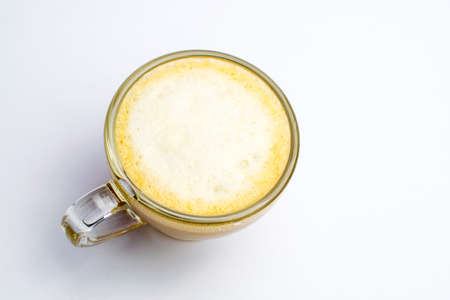 A cup of coffee and milk disposed on a white backgroundの写真素材