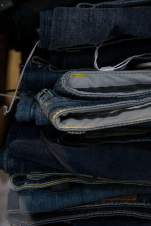 Pairs of jeans close up in a shopの写真素材