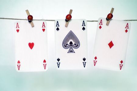 Three ace hanging on a rope