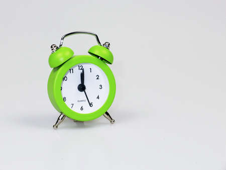 Green Clock Isolated in white backgroundの写真素材