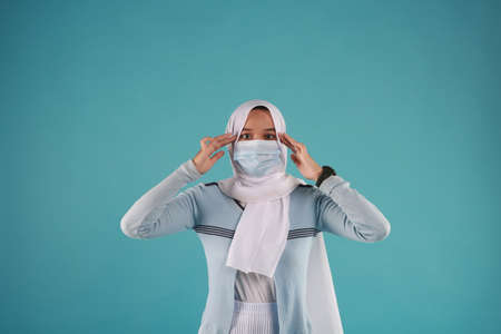 Fashion portrait of young beautiful asian muslim woman with wearing hijab.の写真素材