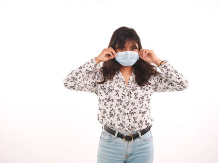 Woman wearing stylish protective face mask, posing on white background.