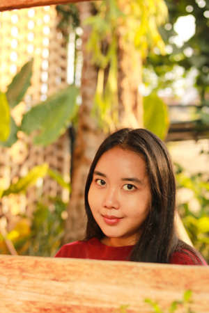 Young beautiful woman wearing red casual t-shirt.