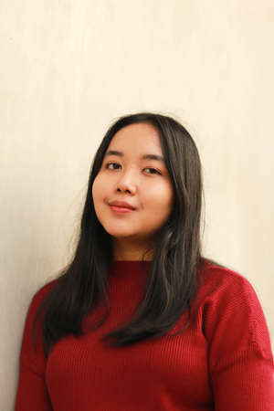 Young beautiful woman wearing red casual t-shirt.