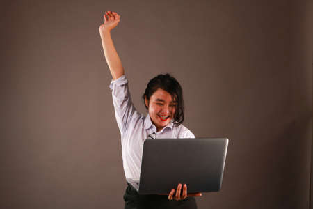 Young woman working on laptop.の写真素材