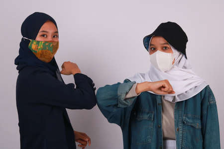 Fashion portrait of three best friends posing in studioの写真素材