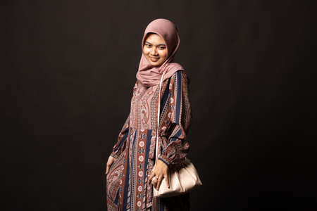 Full length casual young fashion holding bag posing