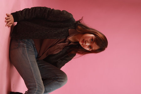 Fashion portrait of beautiful woman on pink background.