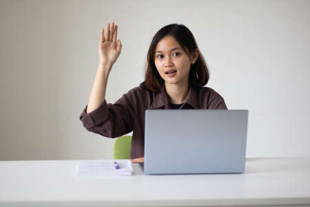 Portrait of beautiful young woman working in the office.