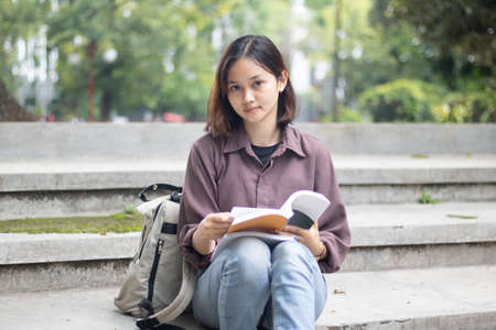 Young woman studying at the park.の写真素材