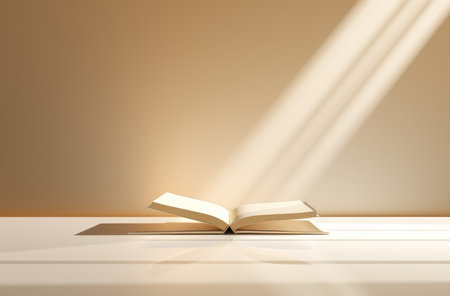 Open book on white table and light from windowの素材