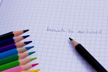 a shot of some colourful pencils on pink background