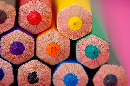 a shot of some colourful pencils on pink backgroundの写真素材