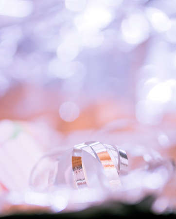  Xmas ornaments and gift wrapping decorations on slver background with shallow dofの写真素材