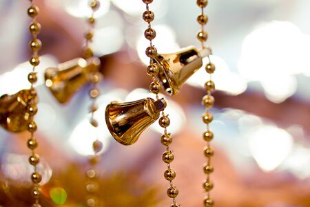 golden bell as ornaments for Christmas treeの写真素材