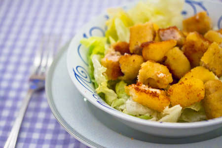 salad with goat cheese and breaded chicken, example of healthy dinnerの写真素材