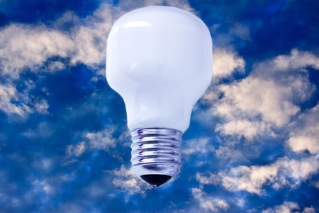 creativity and success, represented by a light bulb on blue skyの写真素材