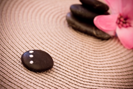 natural beauty care and wellbeing, spa stones and flowers
