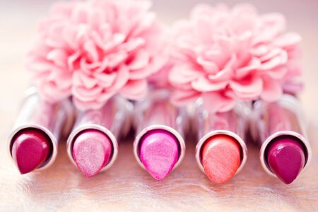 lipsticks colors with flower petalsの写真素材