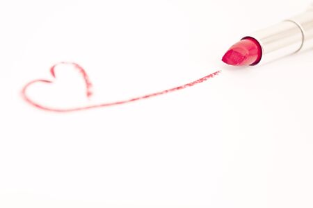 lipstick drawing a heart mark on whiteの写真素材