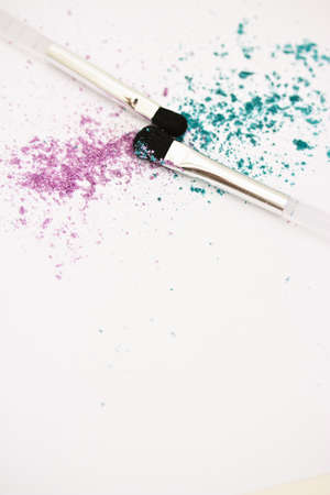 a still-life of colourful eyeshadow powder and make-up brushの写真素材