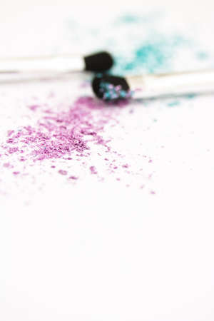 colourful eyeshadow powder & brushes, focus on powderの写真素材