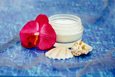 beauty lotion with shells on sea backgroundの写真素材