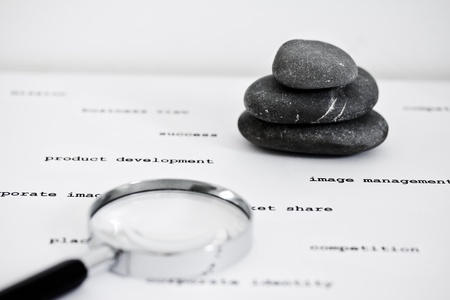 zen stones stacked surrounded by business wordsの写真素材