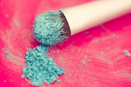 close-up shot of make-up brush with blue eyeshadow powderの写真素材