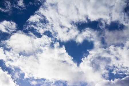 bright blue sky and sun light rays looking serene with birdの写真素材