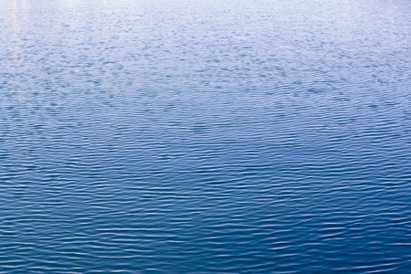 a water texture with gradual color change from deep blue to whiteの写真素材