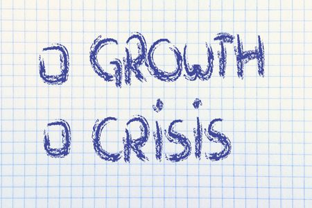 paper notebook with writings about the economic crisis and new growthの写真素材
