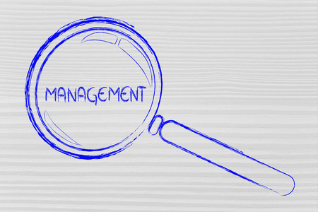 magnifying glass focusing on business vision and managementの写真素材