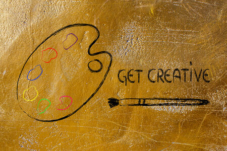 concept of creativity, palette with colors and paint brushの写真素材