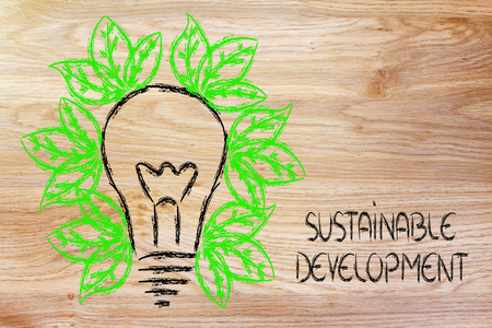 green economy and sustainability, conceptual image with foliage growing around an ideaの写真素材