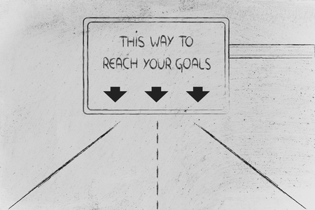 conceptual highway or road signal with the message this way to reach your goalsの写真素材