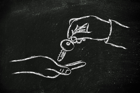 hands giving metaphor key to success, unlock your potentialの写真素材