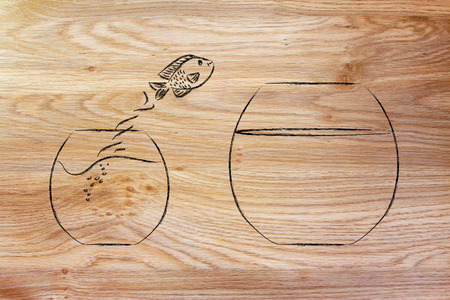 think unconventionally and free your mind, fish jumping into a bigger bowlの写真素材