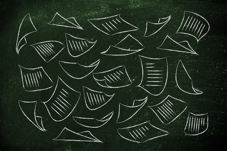 documents flying in the air, information and data overload or lack of organisationの写真素材