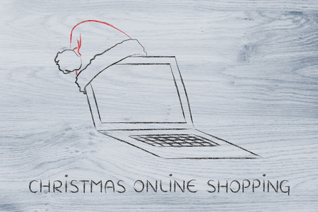 Christmas and holiday shopping online, laptop with santa hatの写真素材