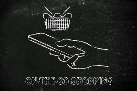 online shopping on the go, cart and hand holding a smartphoneの写真素材