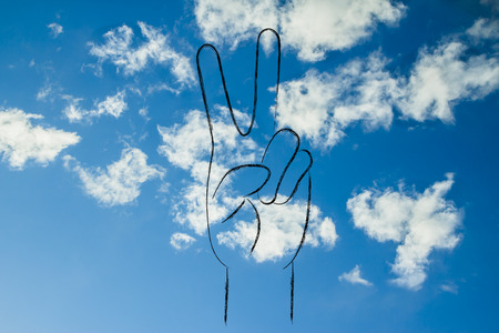 hands making peace signの写真素材