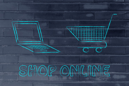 laptop computer and shopping cart, concept of e-commerce and online shoppingの写真素材