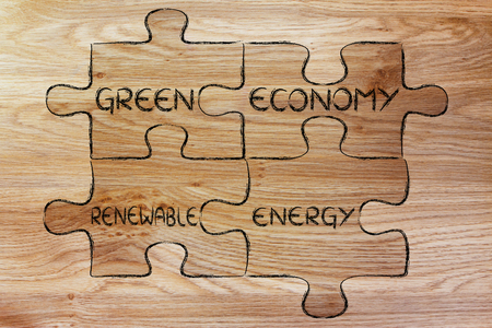 elements of ecology as pieces of puzzle: green economy and renewable energyの写真素材
