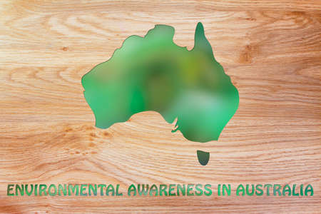 environmental awareness throughout the world: illustration with map of australia made of green leaves blurの写真素材