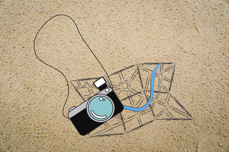 illustration about travel & holidays essential items: camera and map on sand backgroundの写真素材