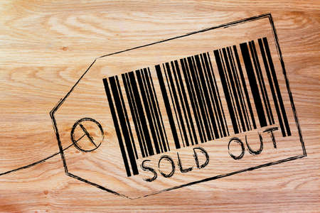 marketing and the retail industry: item label with code bar saying Sold Outの写真素材
