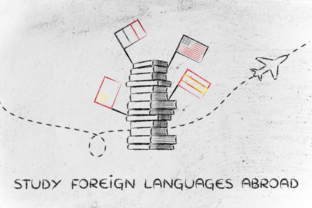 pile of books with flags and airplane flying in the background, studying foreign languages abroadの写真素材