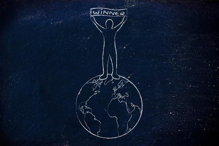 person standing on top of the world holding a banner with text Winnerの写真素材