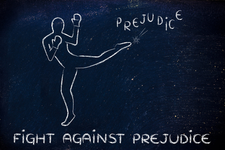 fight against negative concepts: person kicking away the word prejudiceの写真素材